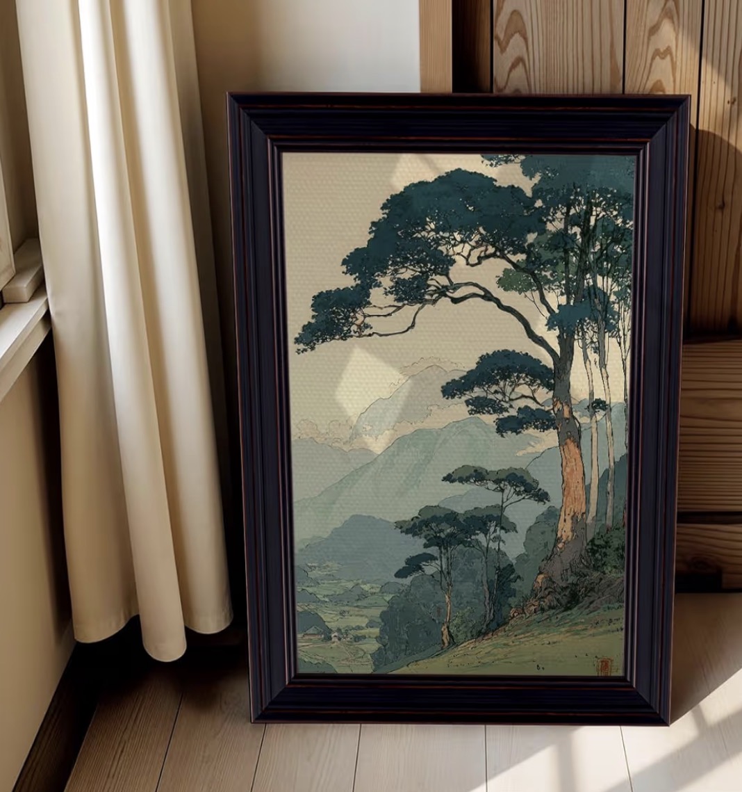 Japanese woodblock mountain landscape canvas print leaning against a curtained window